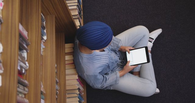 Muslim Woman Using Tablet in Library for Online Study - Download Free Stock Images Pikwizard.com