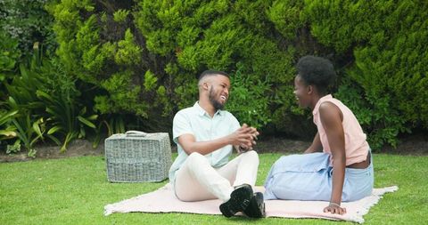 Romantic couple enjoying laughter in lush park