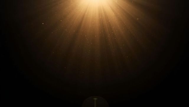Golden Light Beams Radiating in Dark Space with Ethereal Glow
