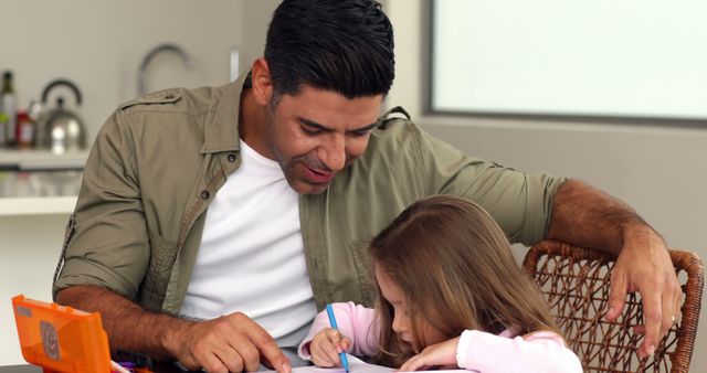 Smiling Father Helping Daughter with Homework at Home - Download Free Stock Images Pikwizard.com