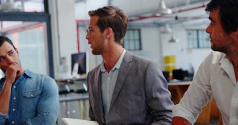 Business Professionals Engaging in Analytical Discussion