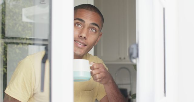 Man Drinking Coffee and Daydreaming Indoors - Download Free Stock Images Pikwizard.com