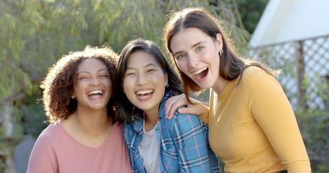 Diverse Female Friends Laughing Together Outdoors