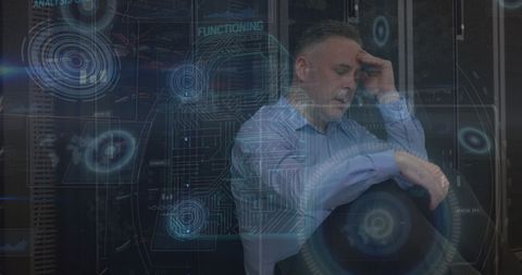 Stressed Professional Amidst Advanced Data Interface - Download Free Stock Images Pikwizard.com