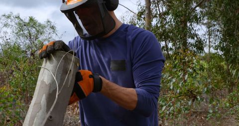 Forestry Worker Operating Chainsaw with Safety Gear in Action - Download Free Stock Images Pikwizard.com