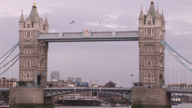 Iconic Tower Bridge located in London showcased against an overcast sky. Offers travelers and admirers of architecture a prominent example of historical bridge design spanning River Thames. Ideal for use in travel brochures, architectural studies, or cultural promotion materials focusing on London landmarks.