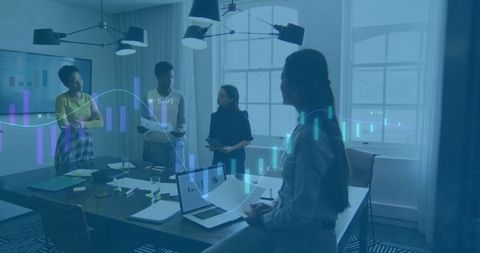 Businesswomen Analyzing Analytics in Modern Conference Room