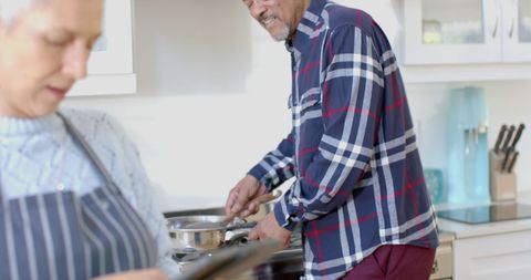 Senior Couple Cooking Together Using Tablet in Bright Kitchen - Download Free Stock Images Pikwizard.com