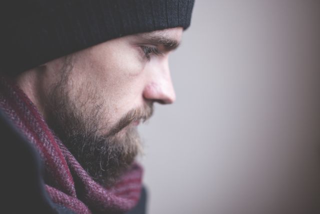 Pensive Man Wearing Beanie and Scarf - Download Free Stock Photos Pikwizard.com