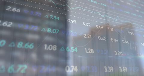 Blurred Stock Market Display Overlapping City Skyline