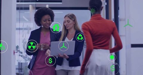 Diverse Colleagues Discussing Sustainability Innovations in Modern Office