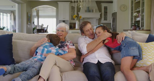 Grandparents Hugging Grandchildren in Living Room - Download Free Stock Images Pikwizard.com