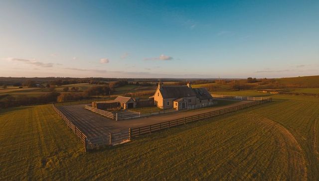 Serene Countryside Farmhouse with Stone Architecture at Sunset
