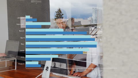 Business Team Analyzing Data with Transparent Graphs Overlay