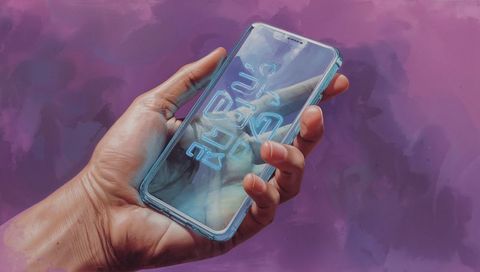 Hand holding smartphone with neon cyan glyphs in clear case on purple background