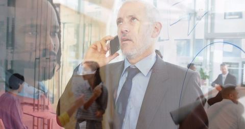 Senior Executive Communicating in Corporate Office Multitasking