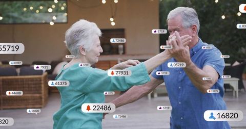 Senior Couple Dancing on Patio Surrounded by Social Media Icons