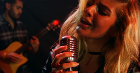 Passionate Live Performance by Young Singer and Guitarist - Download Free Stock Images Pikwizard.com