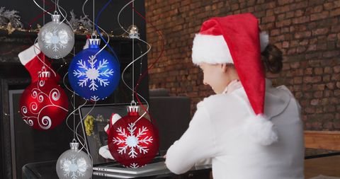 Festive Woman in Santa Hat Video Calling Amidst Christmas Decor
