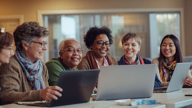 Multigenerational diverse group learning together on laptops in community workshop