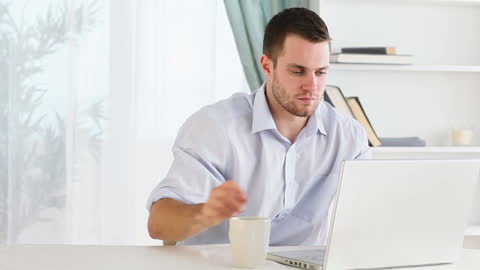 Man Working from Home with Coffee