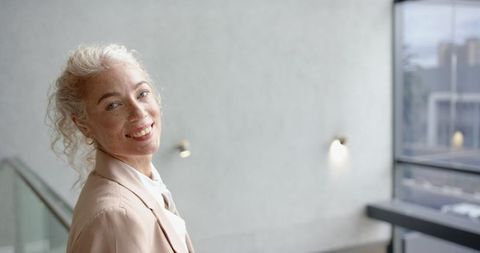 Smiling Professional Woman in Modern Office Setting