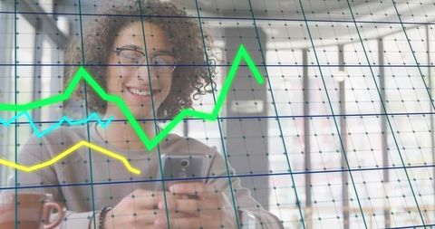 Woman engaging with smartphone and digital analytics in office