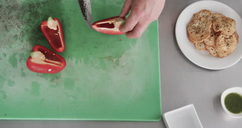 Chef Preparing Bell Peppers on Cutting Board