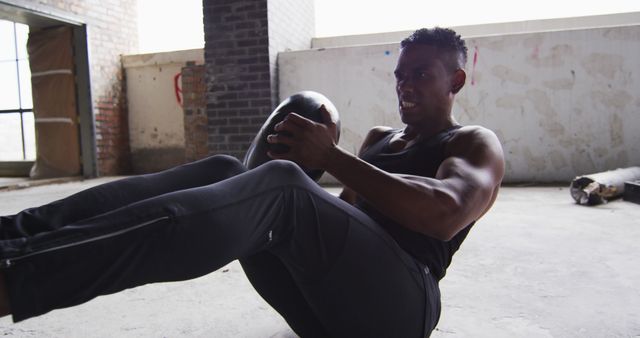 Muscular Man Exercising With Medicine Ball In Industrial Space - Download Free Stock Images Pikwizard.com