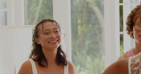 Women celebrating with champagne in elegant wedding attire
