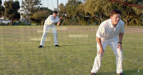 Cricket players training at sunset with digital overlay illustrating ai coaching analytics