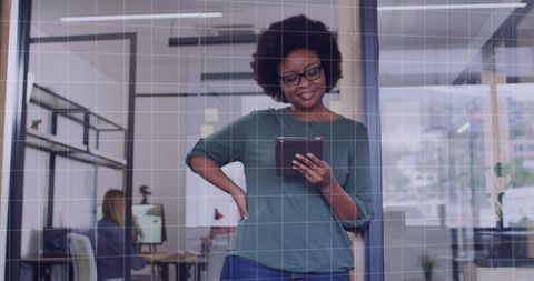 African American Woman Using Tablet in Modern Office