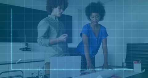 Team analyzing business data in modern boardroom