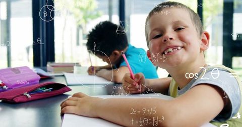 Joyful students solving math problems in classroom setting
