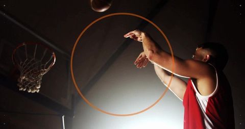 Basketball Player Shooting during Intense Game