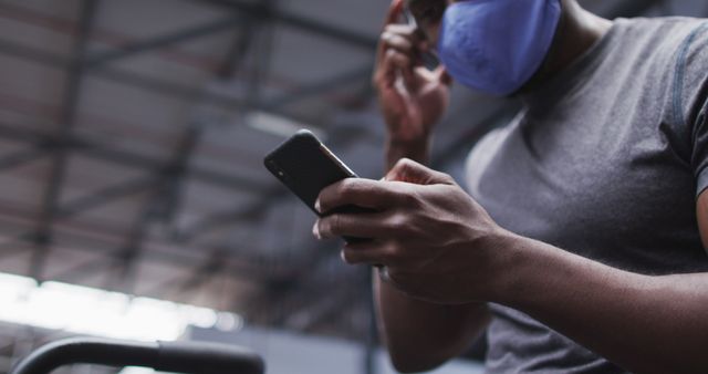 Man Wearing Face Mask Using Smartphone in Industrial Environment - Download Free Stock Images Pikwizard.com