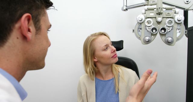 Eye Doctor Consulting Female Patient During Eye Exam - Download Free Stock Images Pikwizard.com