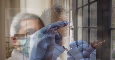 Medical professional prepares covid-19 vaccine for healthcare