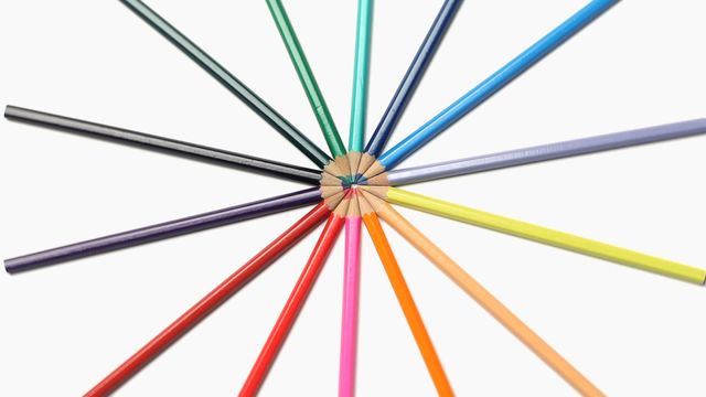 Color pencils arranged in a circular pattern on a white background illustrate creativity, organization, and harmony. Useful for education, art and crafts, learning materials, and creative design concepts.