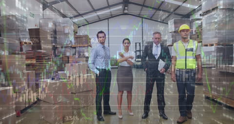 Business Team and Financial Graphs in Warehouse Setting