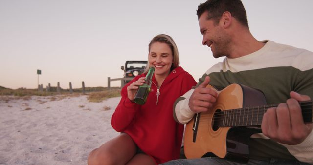 Friends Enjoying Drink and Guitar Music at Beach - Download Free Stock Images Pikwizard.com