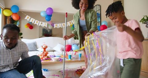 Family Cleaning After Birthday Celebration at Home