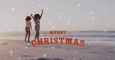 Festive Beach Stroll with Christmas Overlay at Sunset