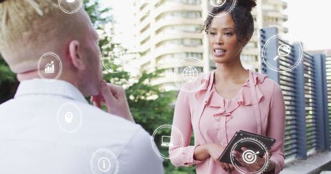 Business Discussion with Data Icons Overlay in Urban Environment