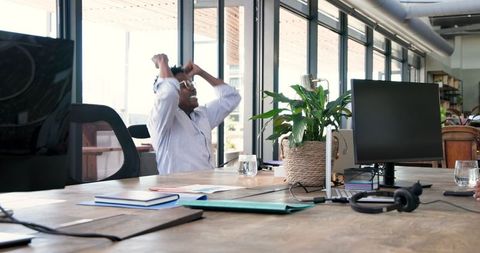 Excited Team Celebrating Success in Modern Office Interior