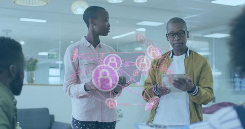 Young Adult Professionals Analyzing Data with Digital Interface