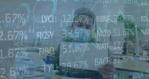 Businessman analyzing financial data with protective mask in office