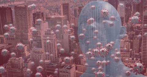 Covid-19 cells overlaying cityscape with transparent human silhouette