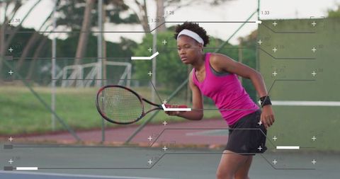 Young Woman Playing Tennis in Vibrant Fitness Apparel Outdoors