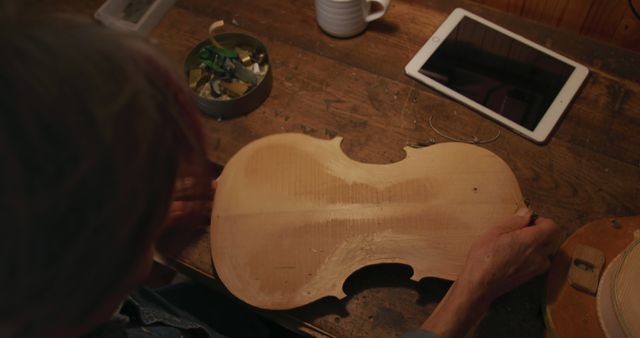 Craftsman Assembling Violin at Wooden Workbench - Download Free Stock Images Pikwizard.com